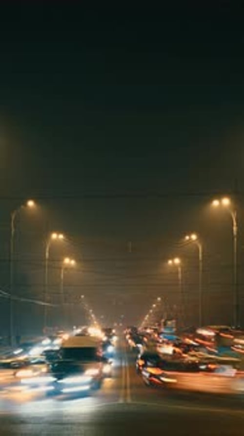 The Vibrant and Dynamic Nighttime Urban Traffic Scene in a Bustling Lively City Setting