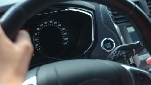 Hand Pressing Car Engine Start Button Inside Modern Vehicle