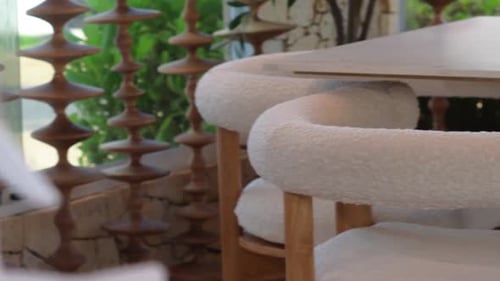 A close-up of a modern, cozy dining table.