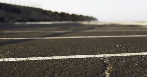 Paved Surface of a Deserted Coastal Road During a Calm Afternoon