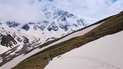 Alpine Scenery of Mountain Peaks in the Clouds