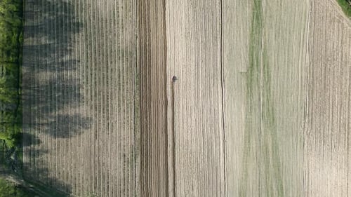 Aerial view of tractor plowing the field