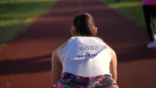 Back View Fit Sportswoman on Marathon in Ready Steady Go Position Start Running