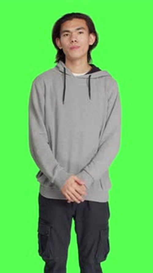 Front View of Young Guy Doing No Gesture in Studio