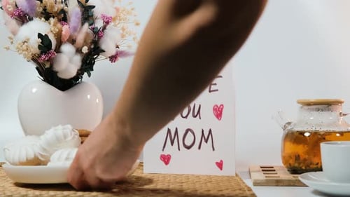Happy Mothers Day still life with flowers and treats