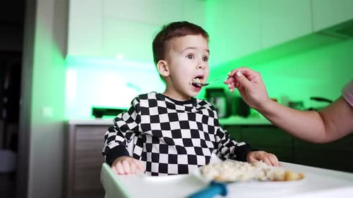 Child Being Fed a Spoonful of Food