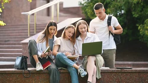 Four Students Studying Together on Campus in Daytime