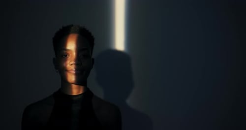 Woman's Face Lit with Natural Light Beam