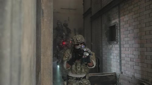 Soldier in civil war, ruined building.