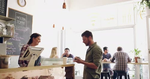 Coffee shop, purchase and barista service for customer by a waitress with espresso for consumer