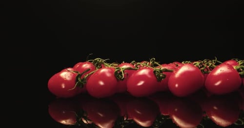 Juicy red cocktail tomatoes super close-up with dark background unique high resolution 4k shoot Glos