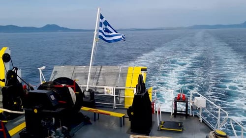 Greek flag from boat in beautiful greek sea