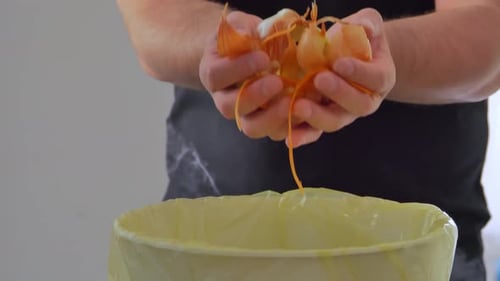 Household Food and Beverage Waste A Man Throws Away the Shell From Vegetables