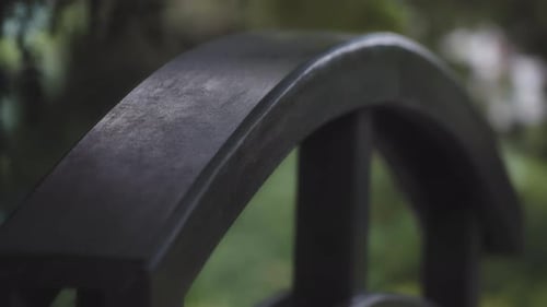Wooden railing of the garden bridge