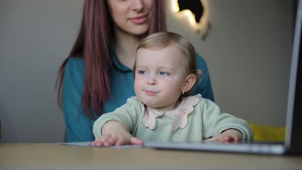 Woman Multitasking Holding Baby Using Laptop Modern Family Dynamics ...