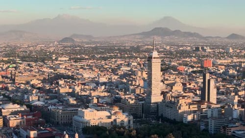 Drone shot of downtown mexico city and volcanoes