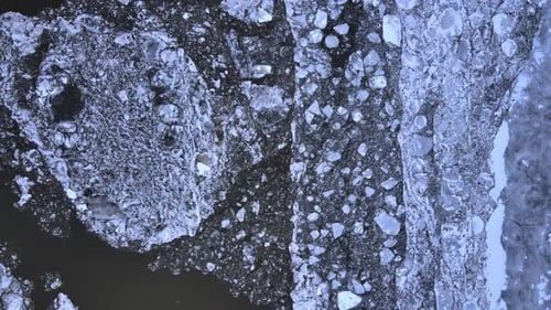 Aerial drone footage of a sea ice floe in salty water during winter