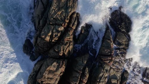 Rough Waves Breaking Onto Rocks At Parque de Punta Herminia In A Coruña, Spain. Aerial Slow Motion S