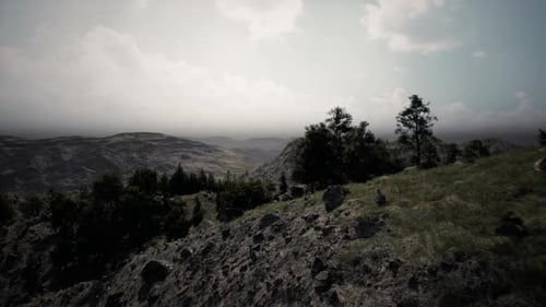 Vast Mountain Landscape Under Cloudy Skies in a Serene Wilderness Setting