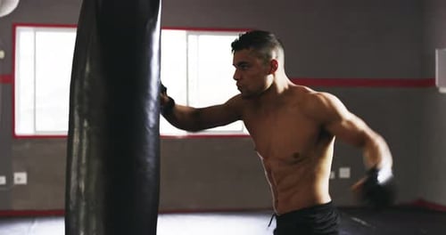 4k video footage of a young male boxer practicing in the gym