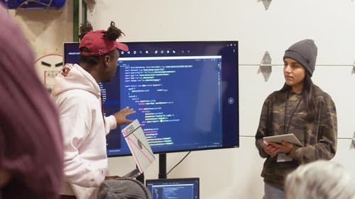 Group Collaboration Around Code on Display Monitor