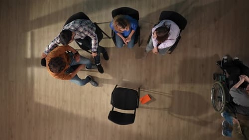 Adults Sitting in Circle Having a Group Meeting