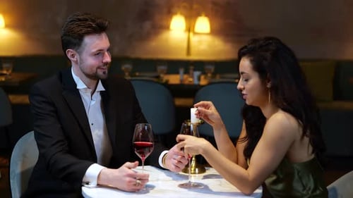 Happy Couple Talking While Holding Hands Sitting in the Restaurant Romantic Dinner Lifestyle Love