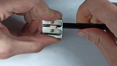 Sharpening Black Eyeliner Pencil with Silver Sharpener