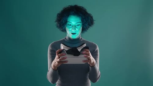 Woman Holds Virtual Reality Headset in Studio