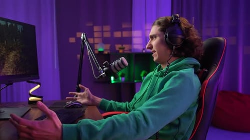 Gamer Streaming Online Video Game in Purple Room