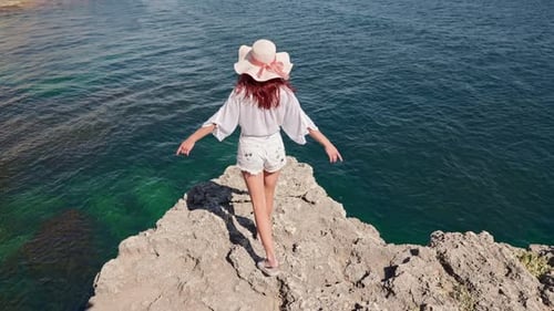 Woman Comes Edge Cliff Raises Her Arms Sides Enjoying Clear Sea Water