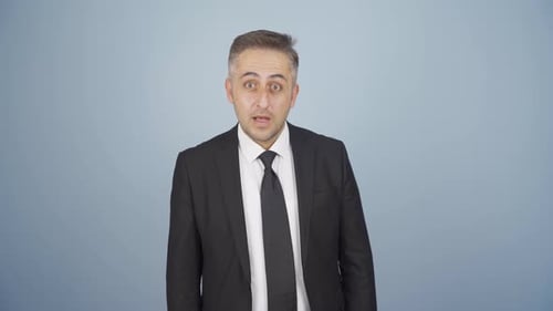 Professional Man Talking Directly to Camera in Suit