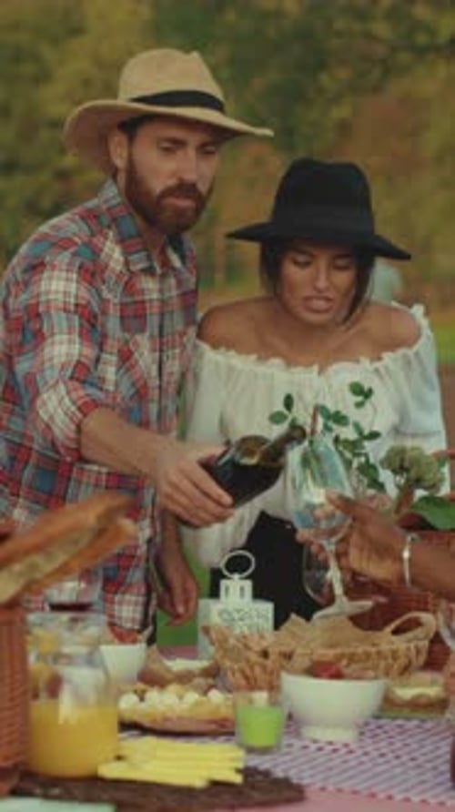 Friends Enjoying a Gourmet Picnic in the Countryside