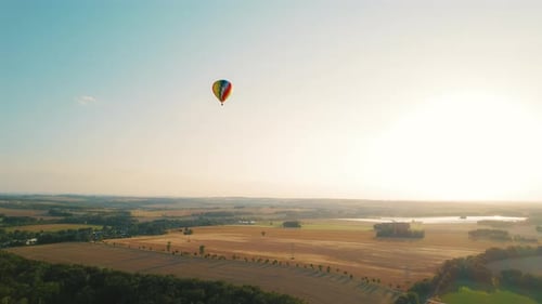 Hot Air Balloon Over Scenic Rural Landscape