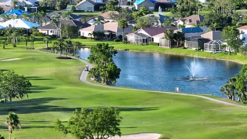 Professional Golfer Driving Golf Cart on Golf Course in Sunny Florida Outdoor Activities of Rich