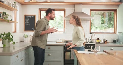 Couple Arguing in a Modern Kitchen