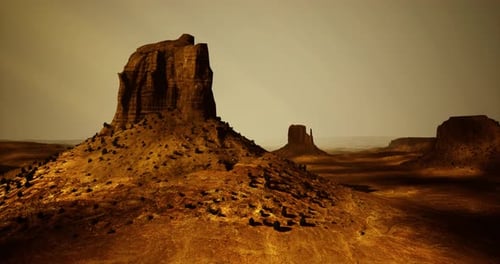 Majestic Rock Formation in a Vast Desert Landscape at Twilight Hour