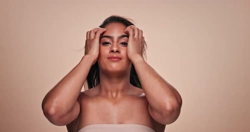Beauty, face and hair with woman at salon in studio on beige background for shampoo