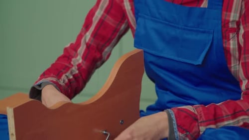 Woman Assembling Furniture Indoors