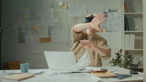 Concentrated Manager Using VR Headset at Work on New Project at Office