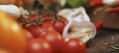 Fresh Vegetables Including Tomatoes and Garlic