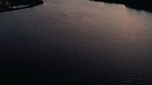 City skyline on riverside at sunset