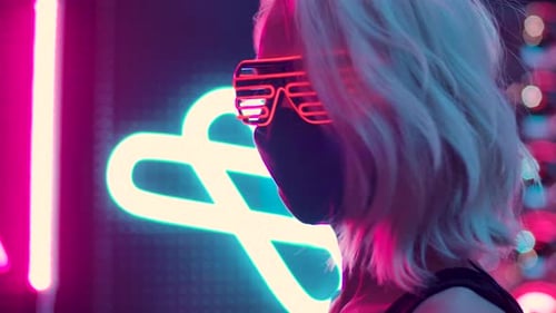 Confident woman in futuristic glasses masked and glowing in neon party lights