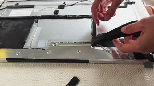 Man self repairing a computer