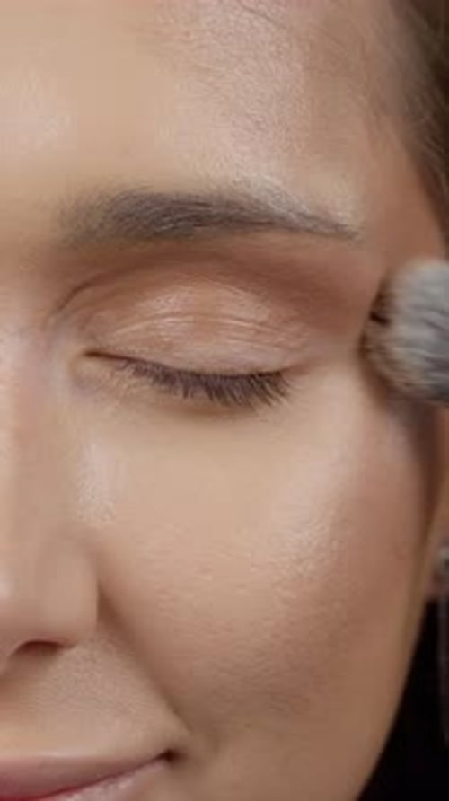 Close Up of Woman Applying Facial Makeup