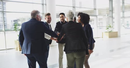 Diverse Team Hands Together in Office, Cheering
