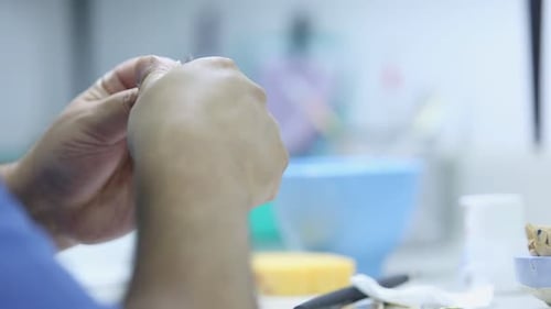 Dentist Repairing Tooth with a Drill in Office