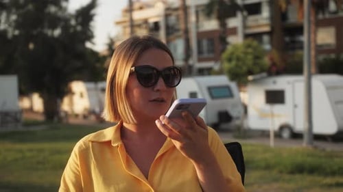 Woman Talking on Phone in Urban Setting