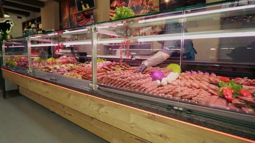 Selection of different cuts of fresh meat raw red in a supermarket.