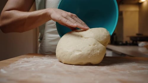 Dough Placed on Floured Wooden Table